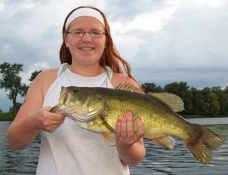 Brilyn Brecka has mastered her father's bass fishing techniques. Below: A plastic frog bait and a slow, steady retrieve can work well. - Photo credit: DNR